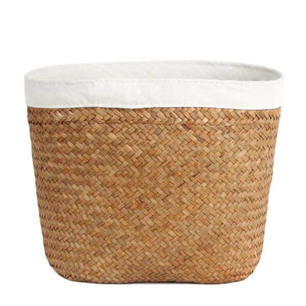 Cache pot en rotin et tissu sur fond blanc